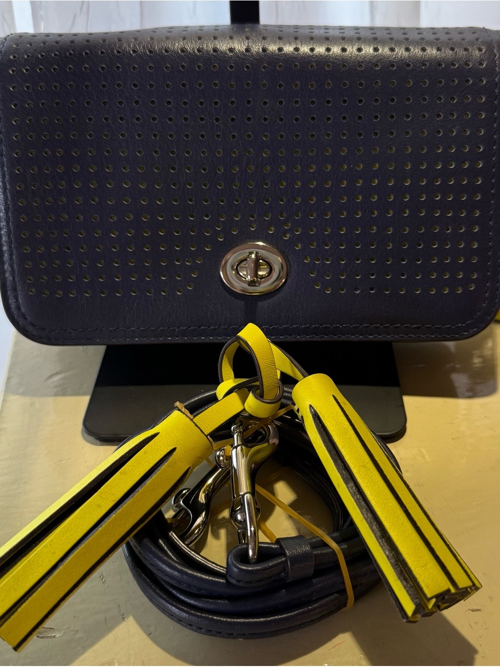 Coach Navy Perforated Penny Crossbody with Yellow Tassel Accents